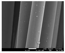 Continuous production process for enabling gold metal to be firmly attached to aromatic special fiber filaments
