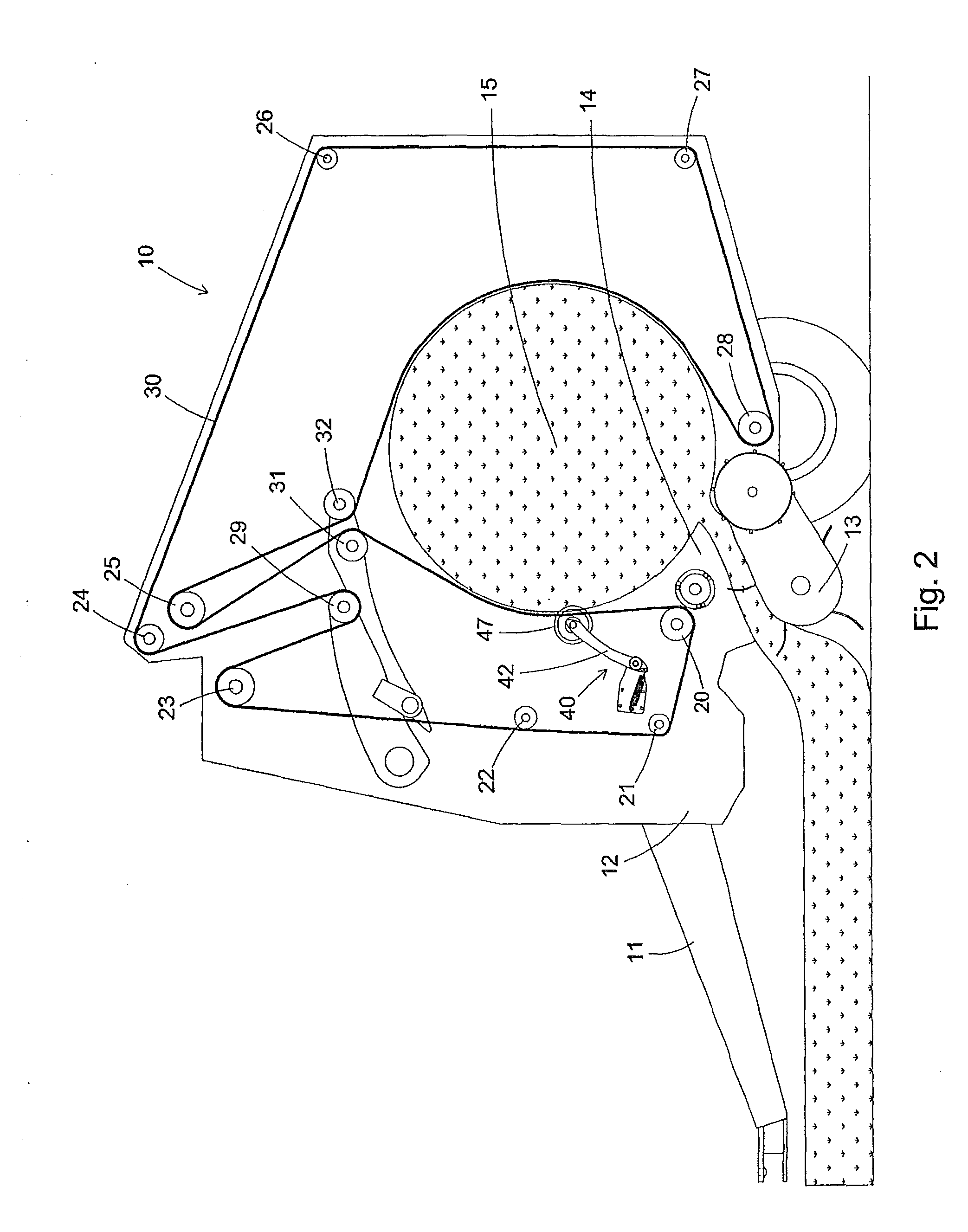 Rotary hay wedge for round balers