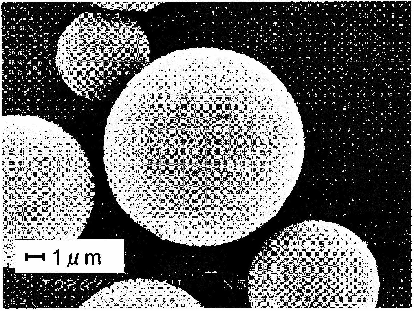 Carbon microparticle and process for production thereof