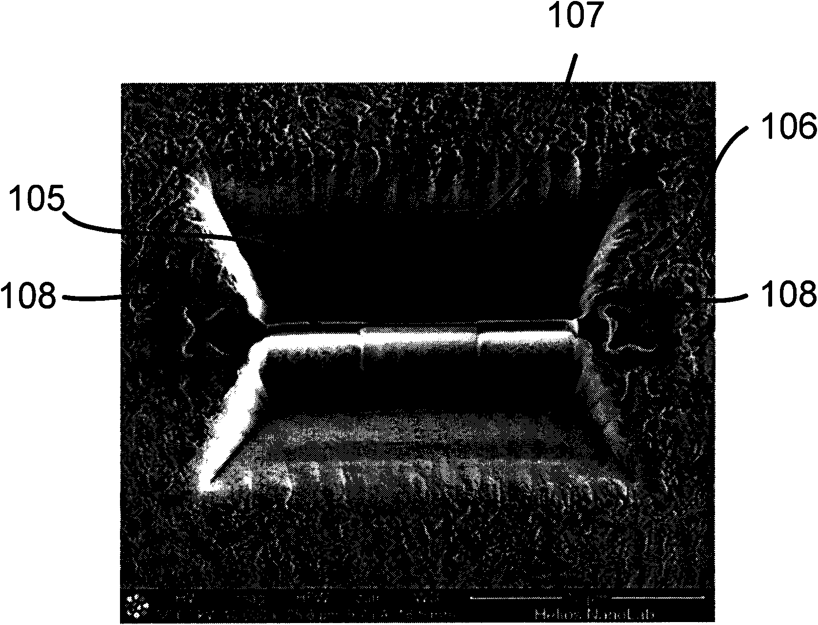 Method of machining a work piece with a focused particle beam