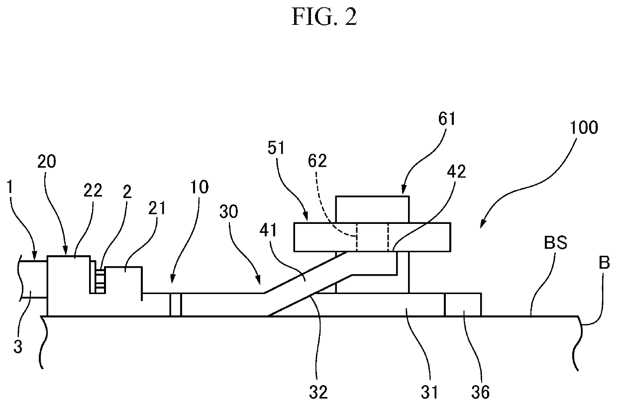 Terminal, and mounting structure of terminal and mounting surface