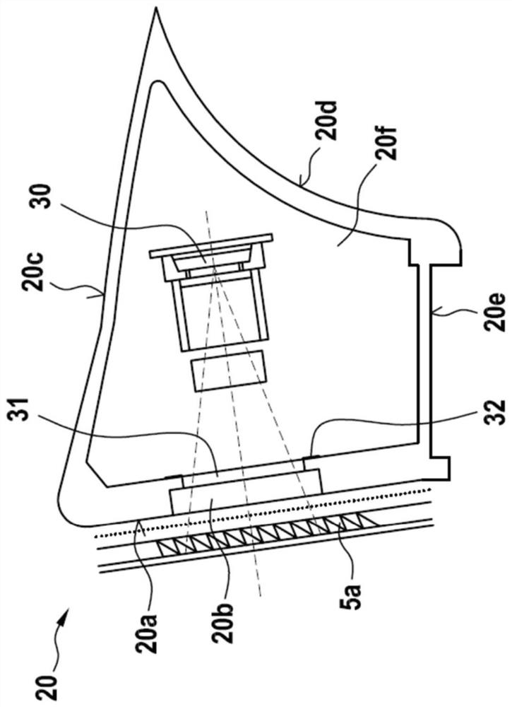 Carding machine with device for detecting interfering particles
