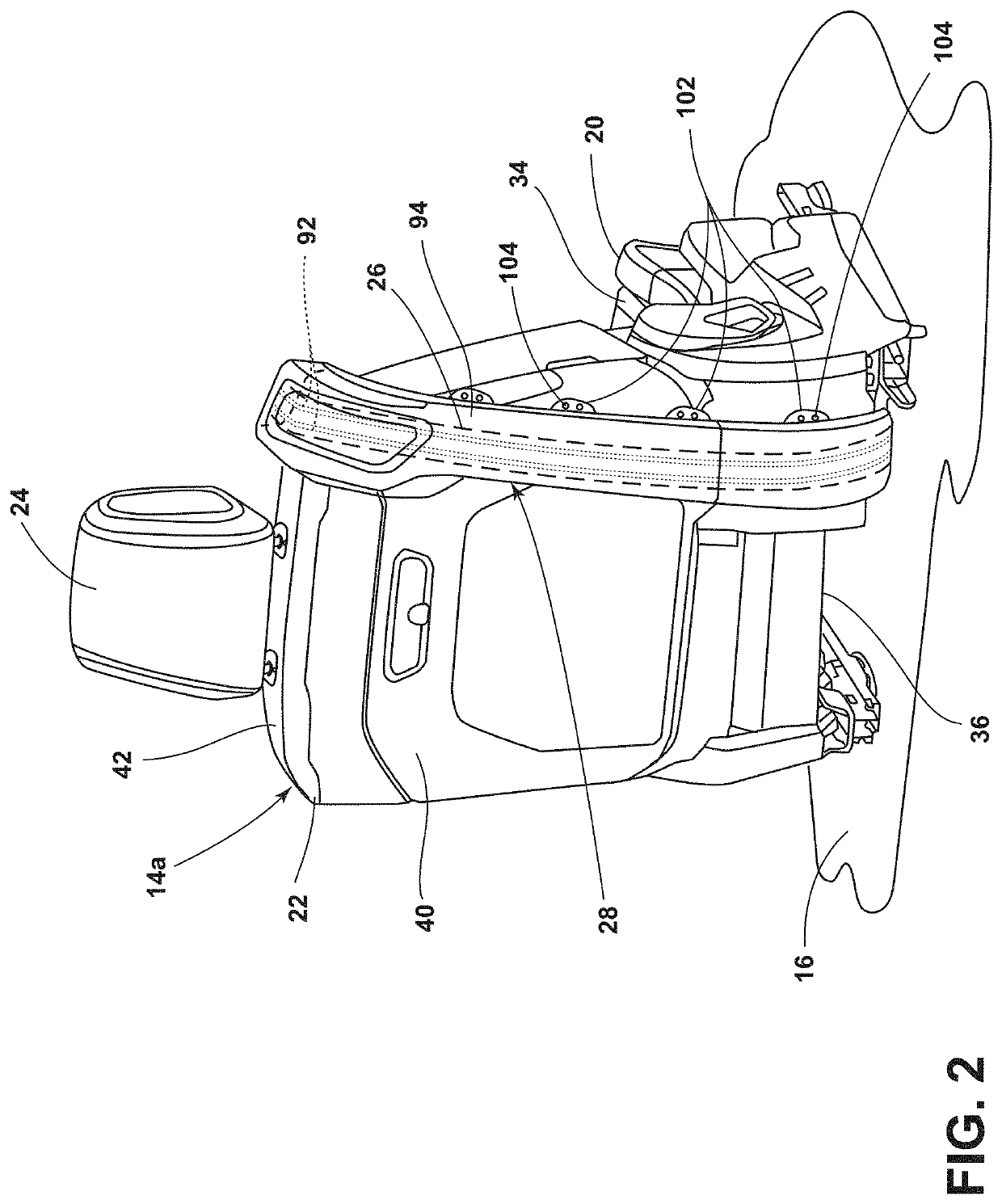 Seating assembly for a vehicle with emitters of ultraviolet C radiation to disinfect seatbelt webbing