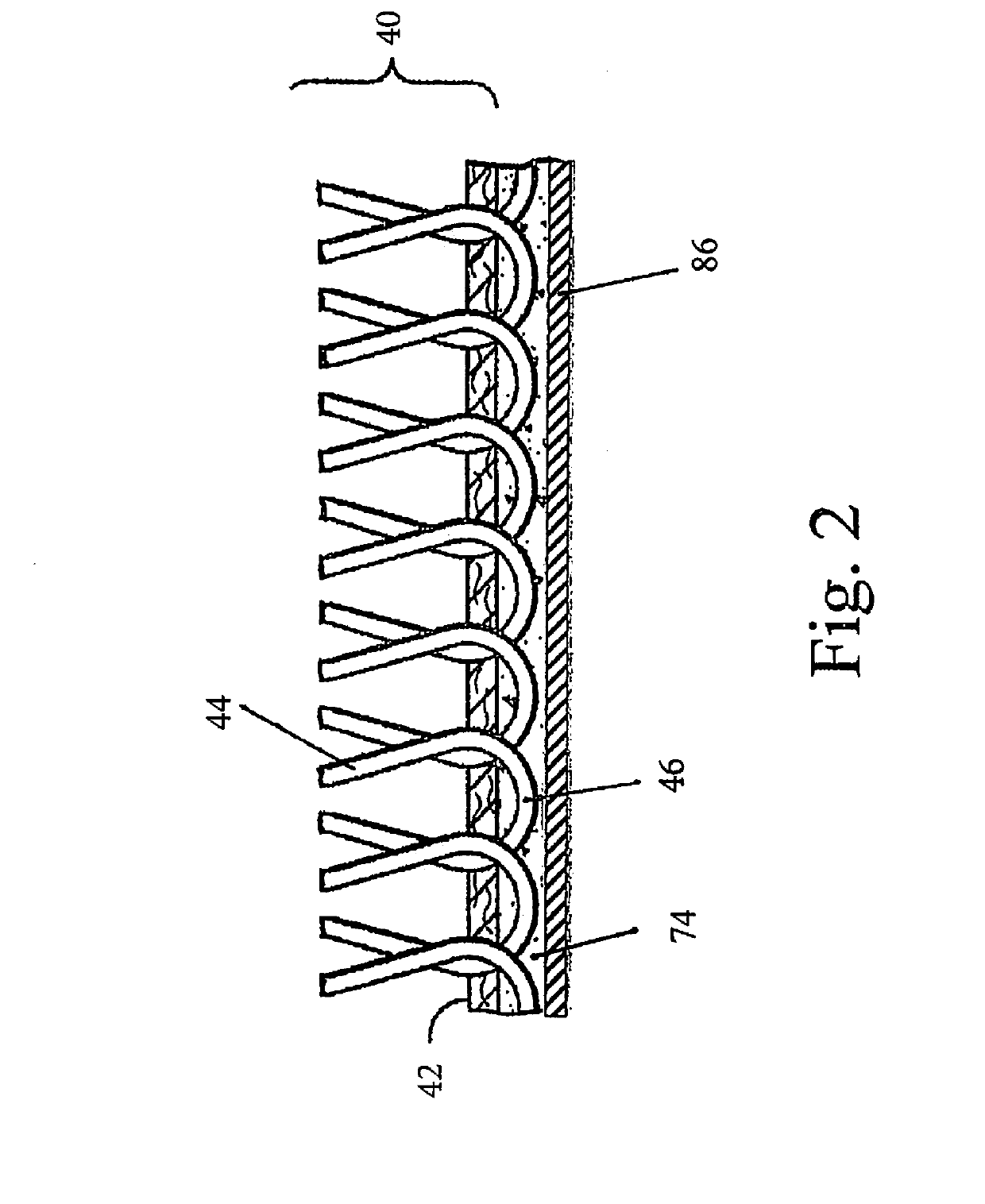 Water permeable artificial turf and method of making same