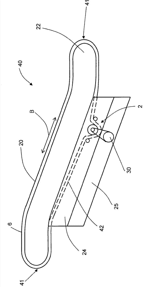 Device for driving a handrail for an escalator or moving walkway