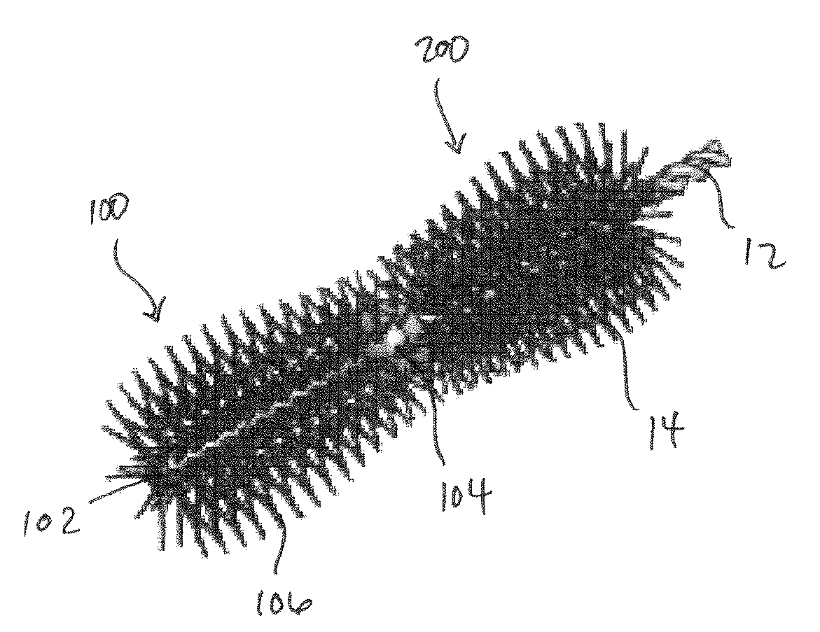 Twisted in wire brush having a molded tip and method of assembly therefor