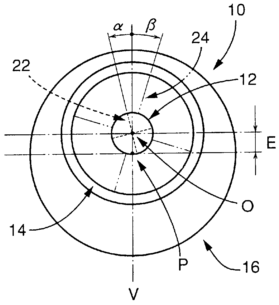 Toric multifocal lens having different astigmatism corrective optical powers in respective vision correction regions, and method of producing the same
