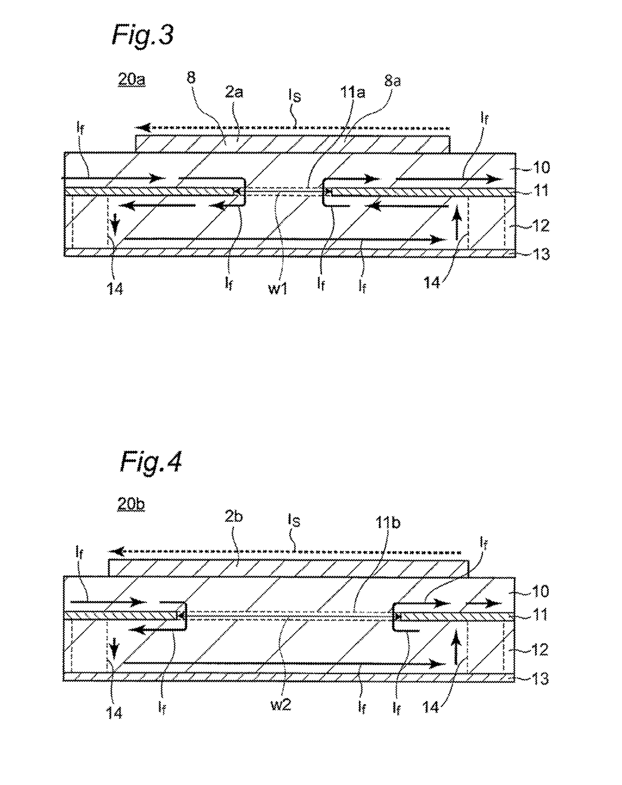 Parallel differential transmission lines having an opposing grounding conductor separated into two parts by a slot therein