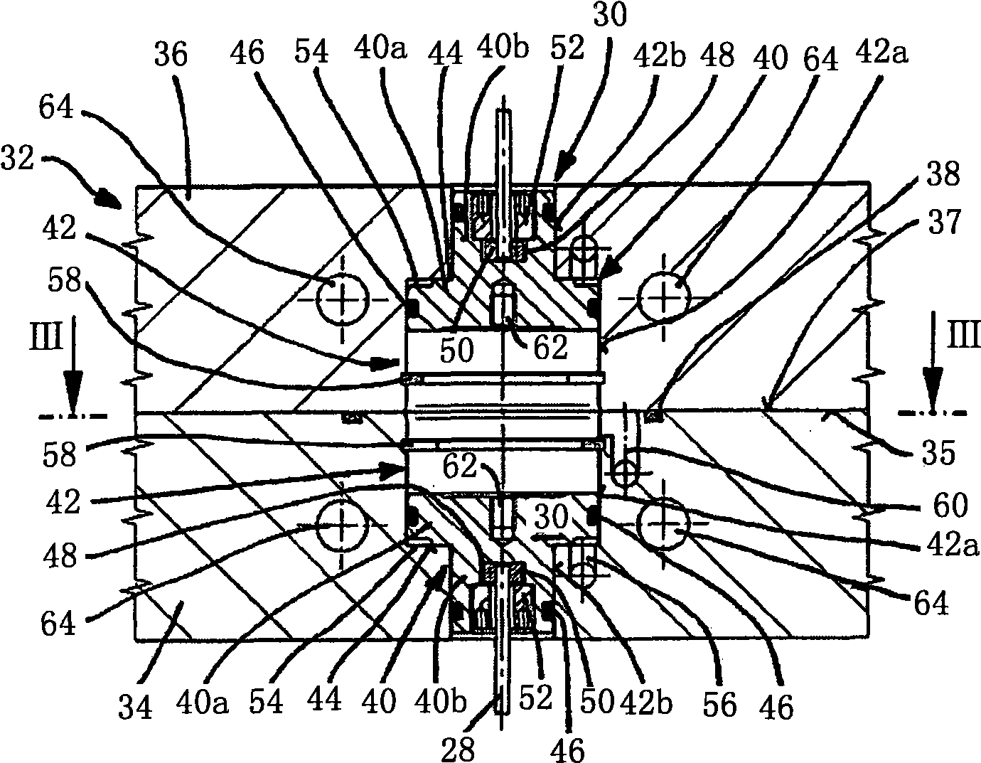 Injection moulding device comprising needle valve nozzles in a back-to-back arrangement