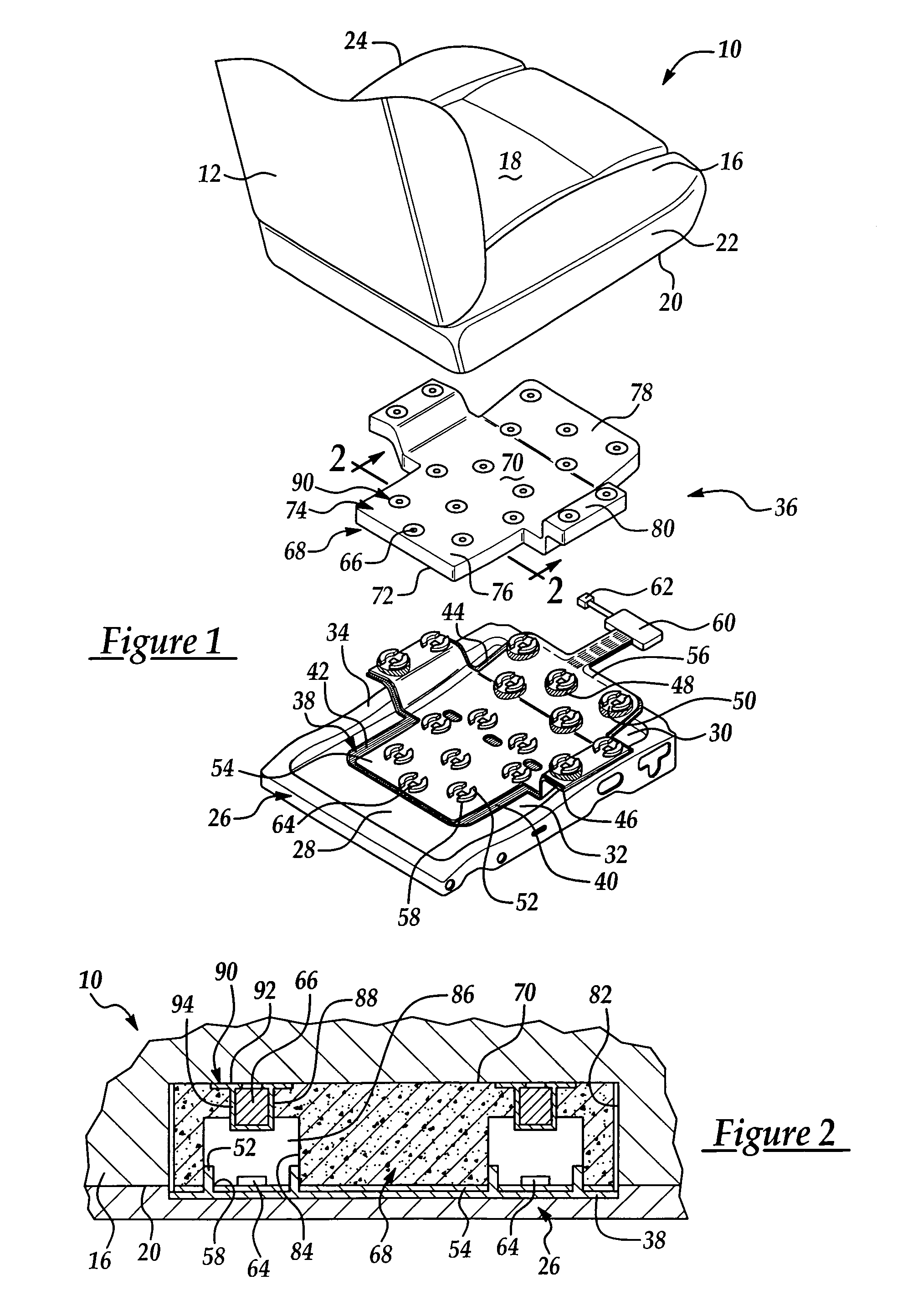 Vehicle seat assembly having a vehicle occupant sensing system with a biasing pad