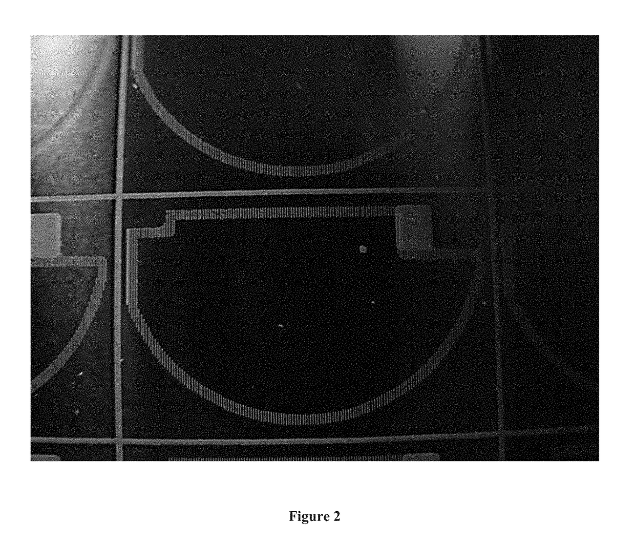 Use of etch resist masked anode frame for facilitation of laser cutting, particle and leakage current reduction