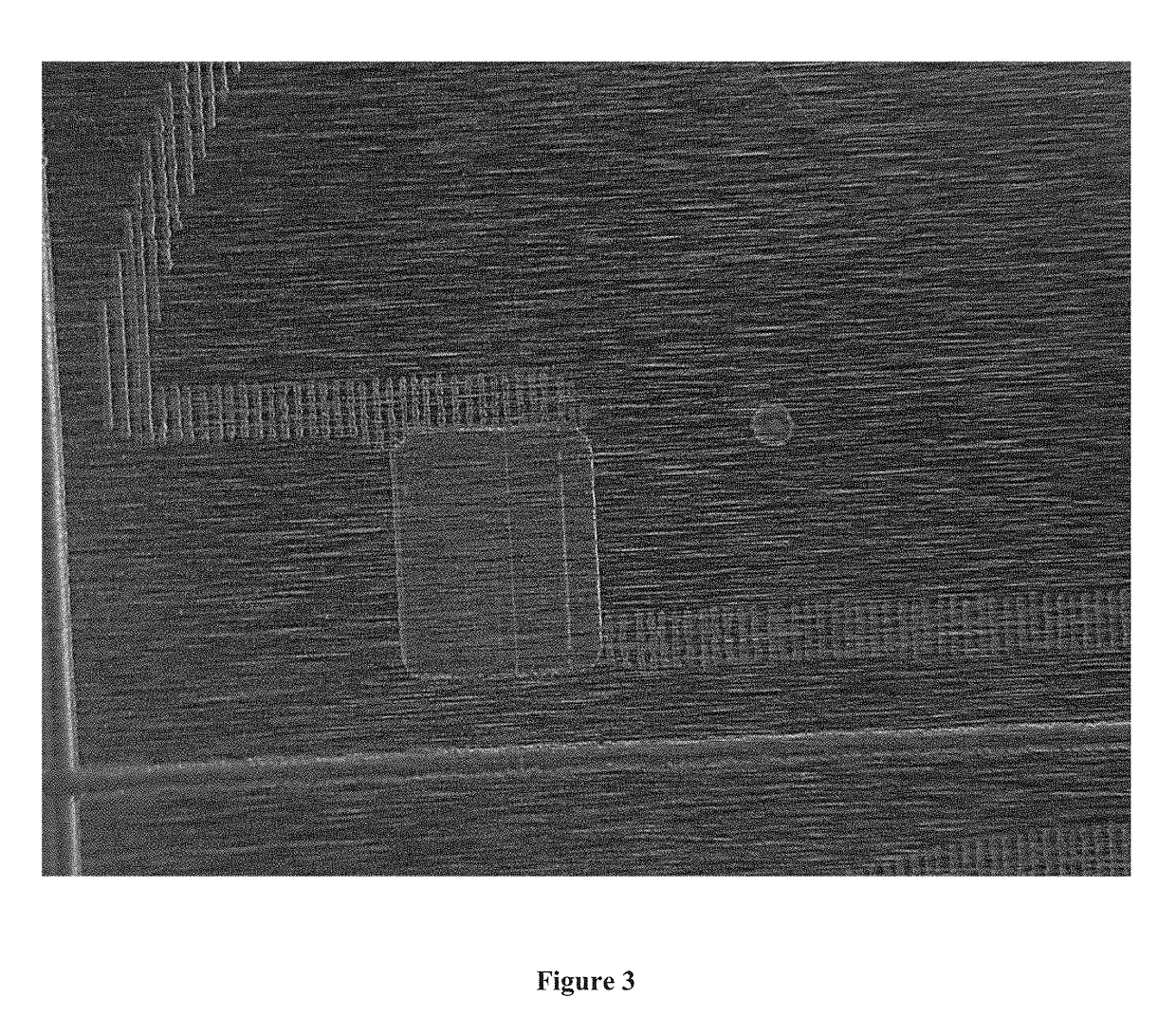 Use of etch resist masked anode frame for facilitation of laser cutting, particle and leakage current reduction