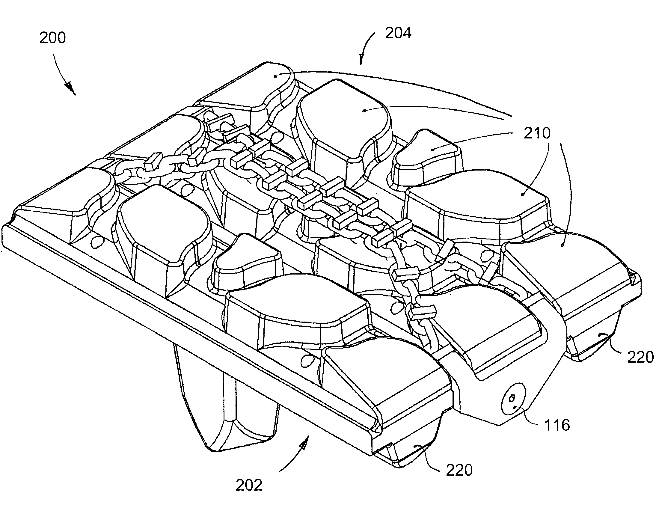 Traction chain assembly for elastomeric tracks