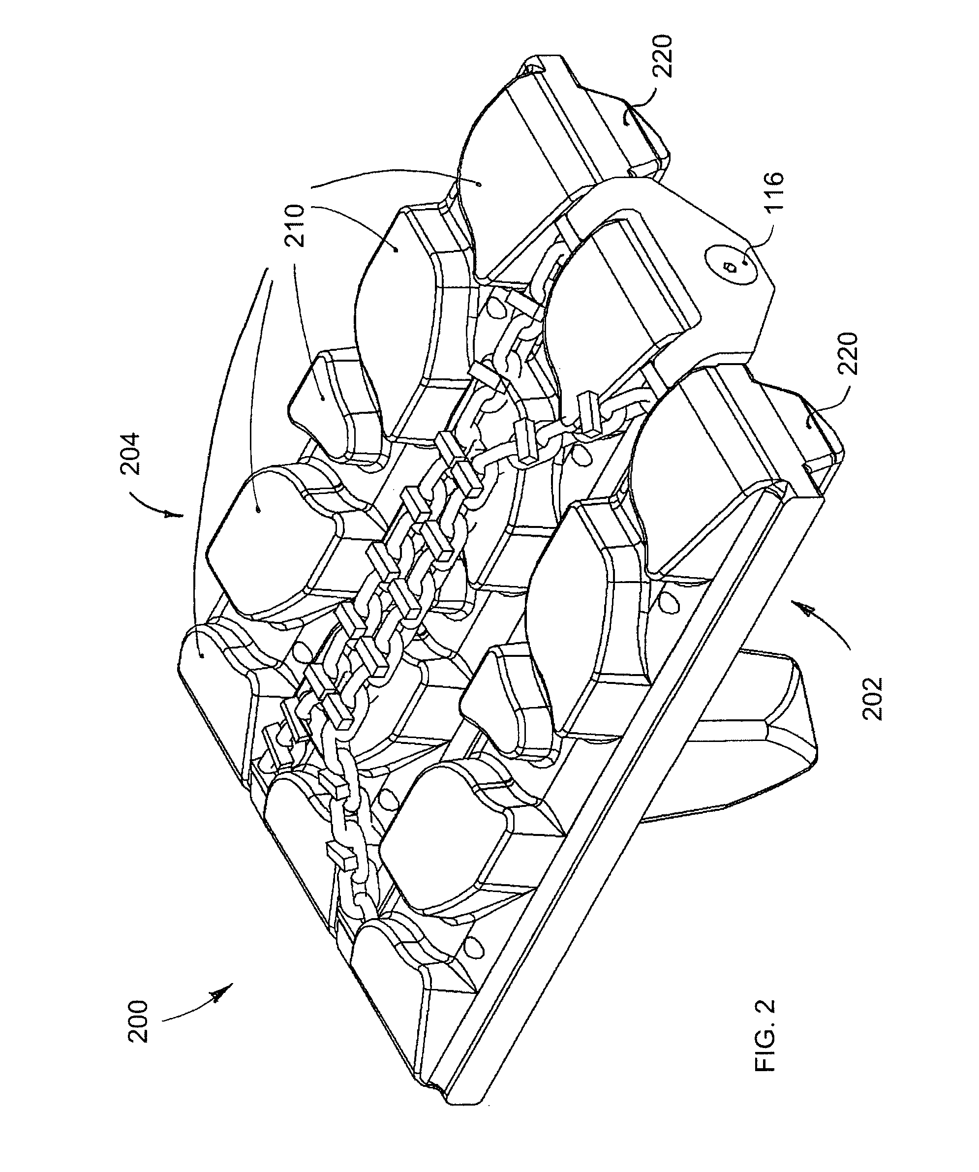 Traction chain assembly for elastomeric tracks