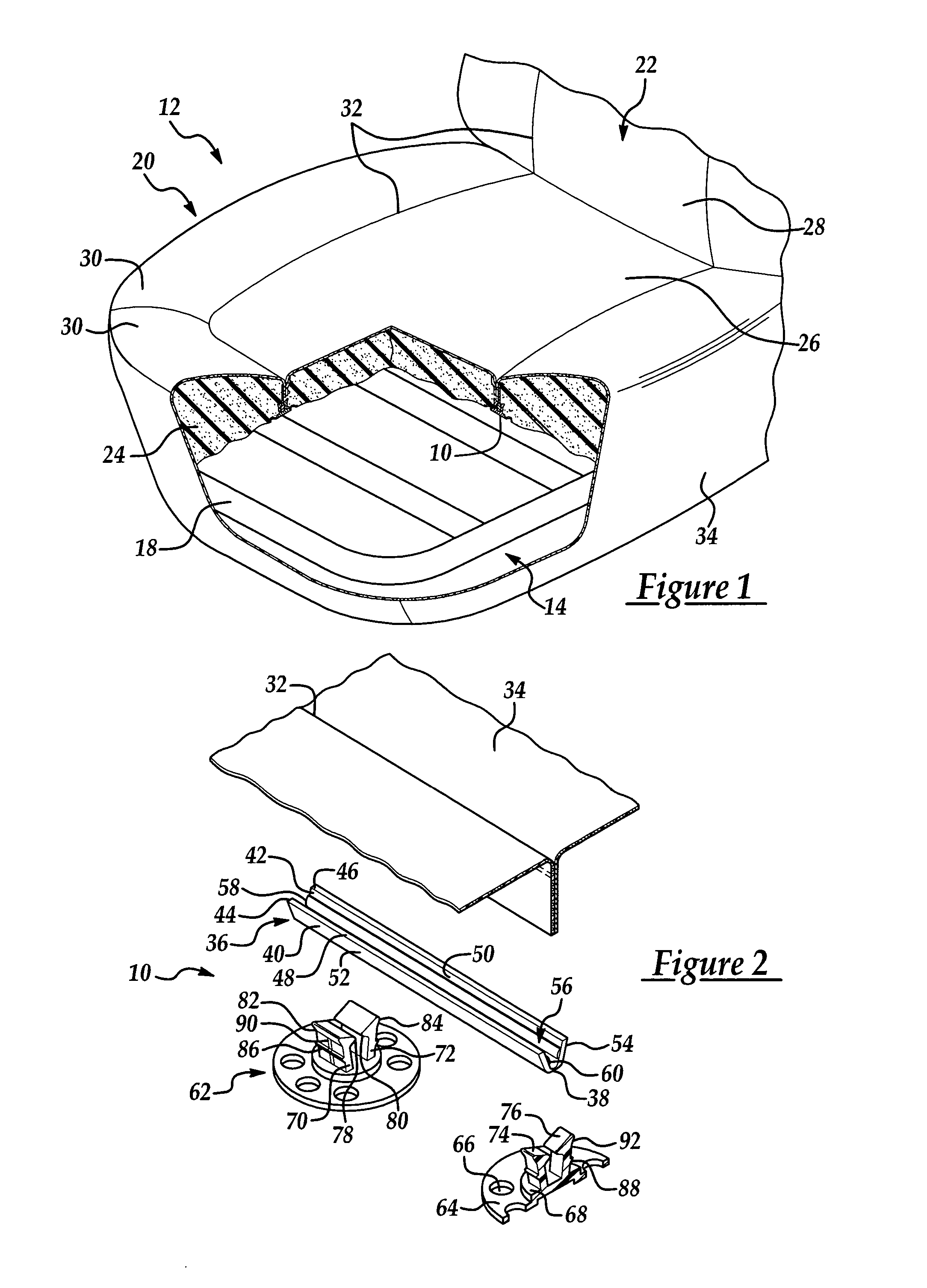 Attachment assembly for securing trim material to the padding of a vehicle seat