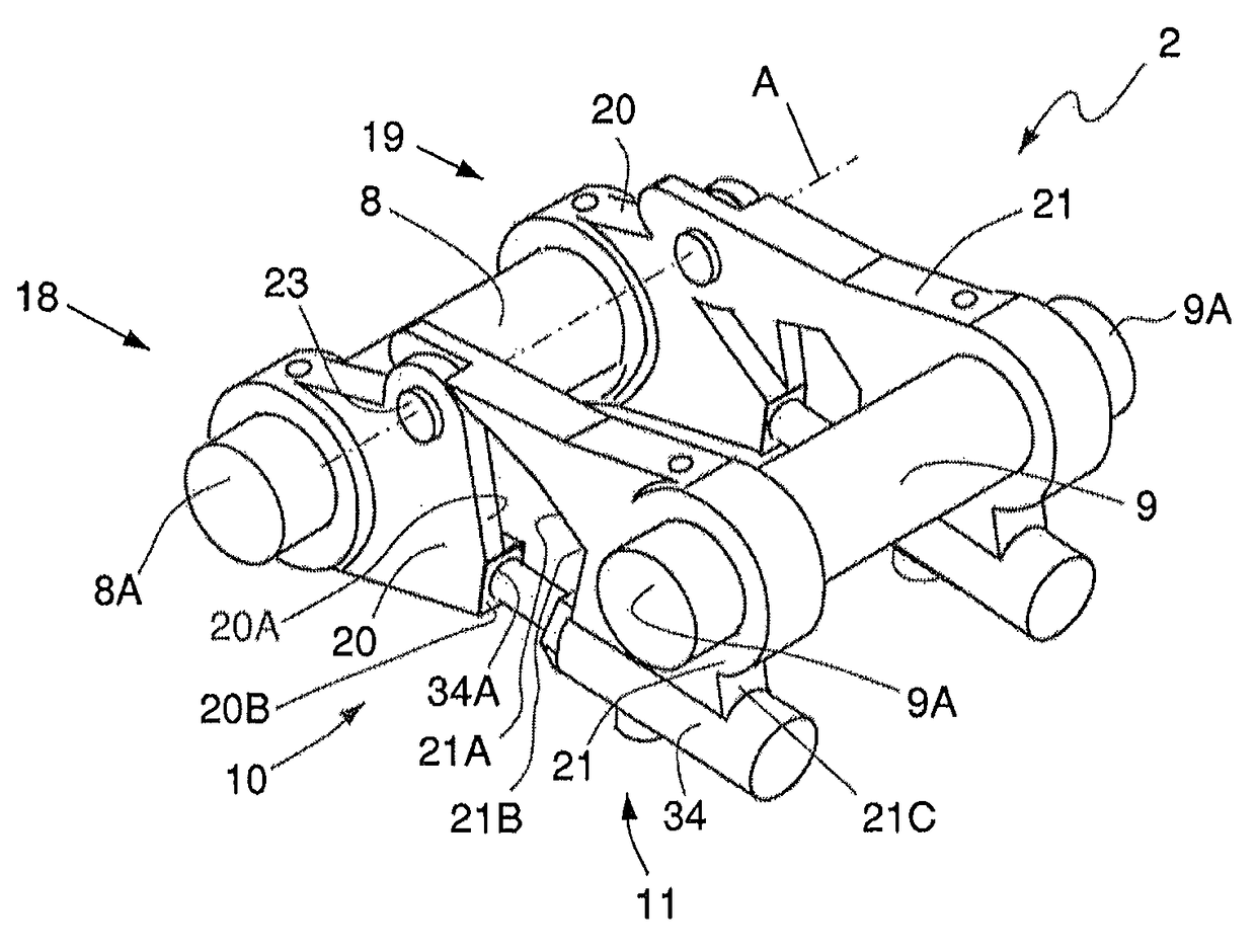 Arrangement for the removable coupling of a tool with a manoeuvrable arm of a working machine