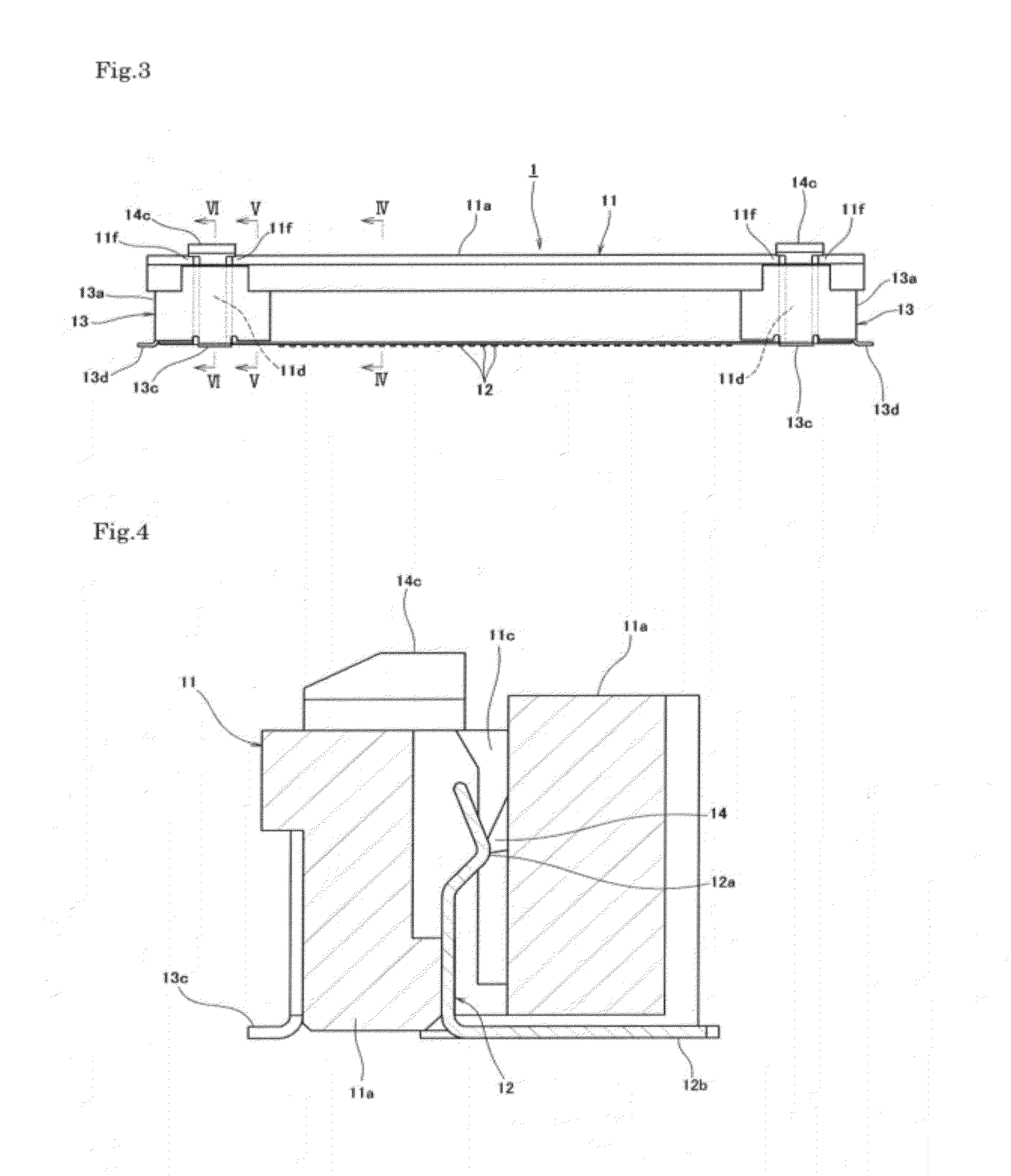 Electrical connector having a board connection leg portion with a locking portion to engage a signal transmission medium and a connector main body with an unlocking portion