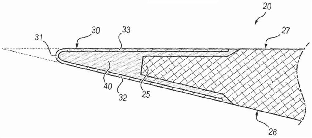 Turbomachine assembly comprising fan blades with an extended trailing edge