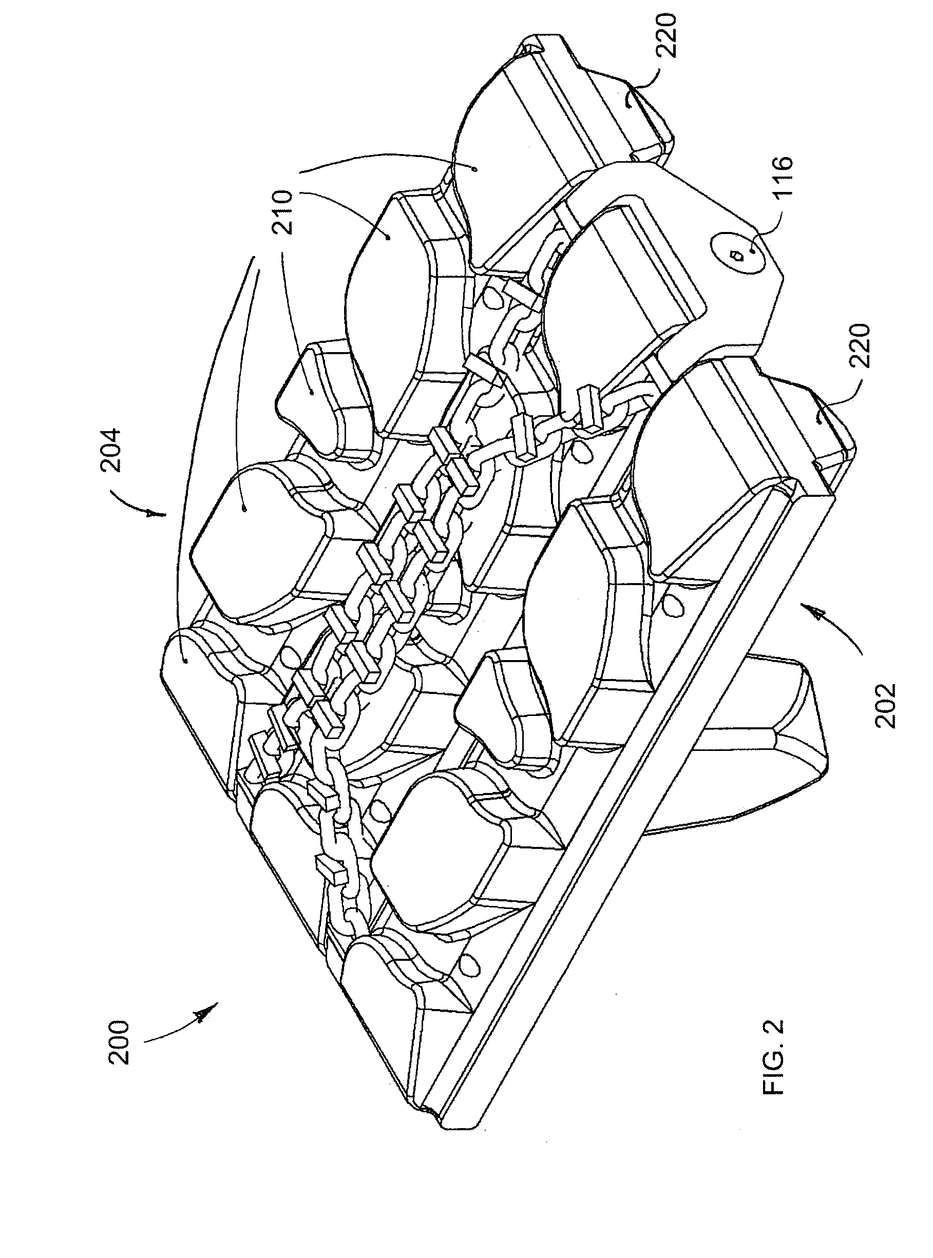 Traction chain assembly for elastomeric tracks