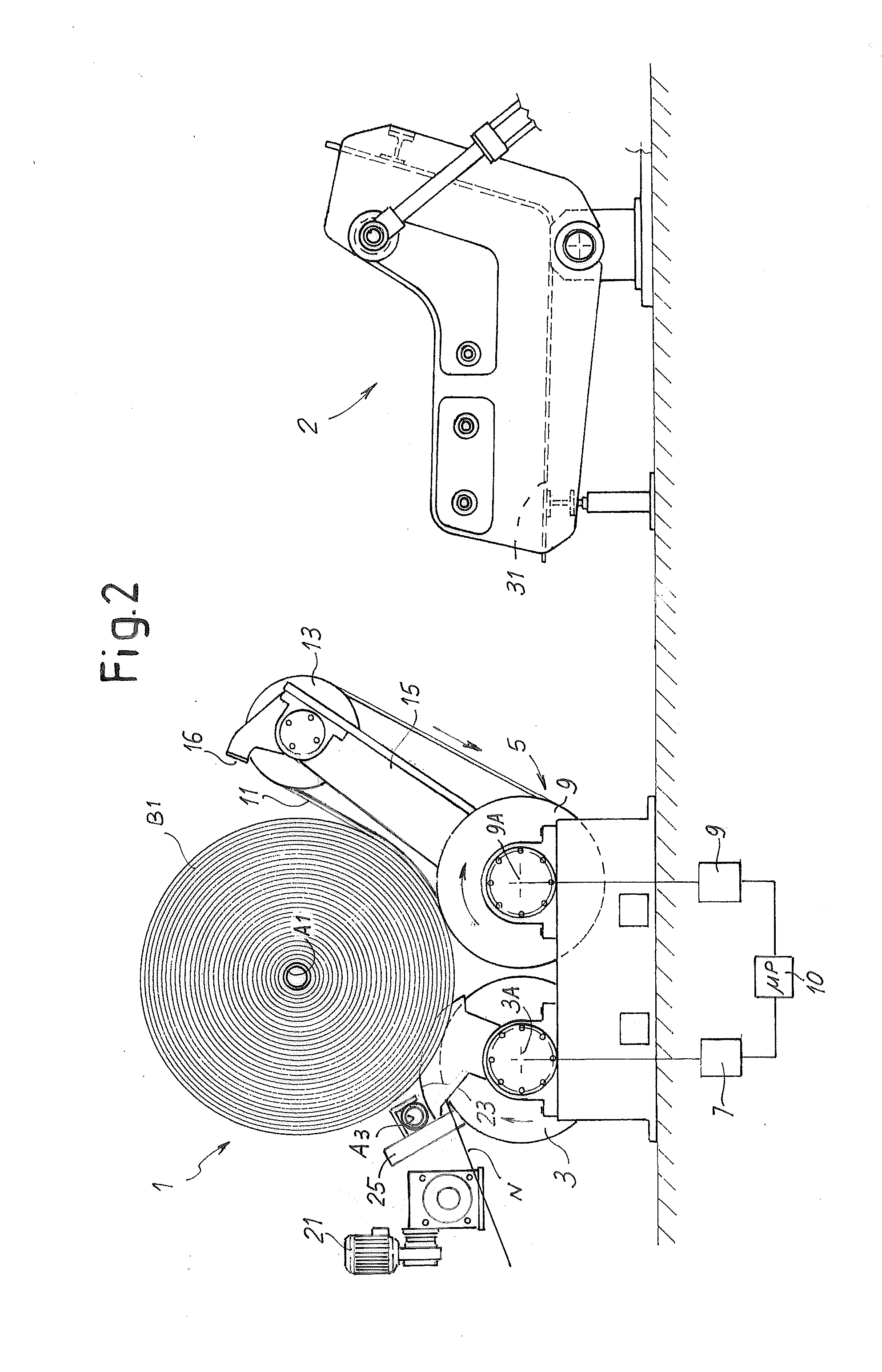 Machine and method for winding reels of web material