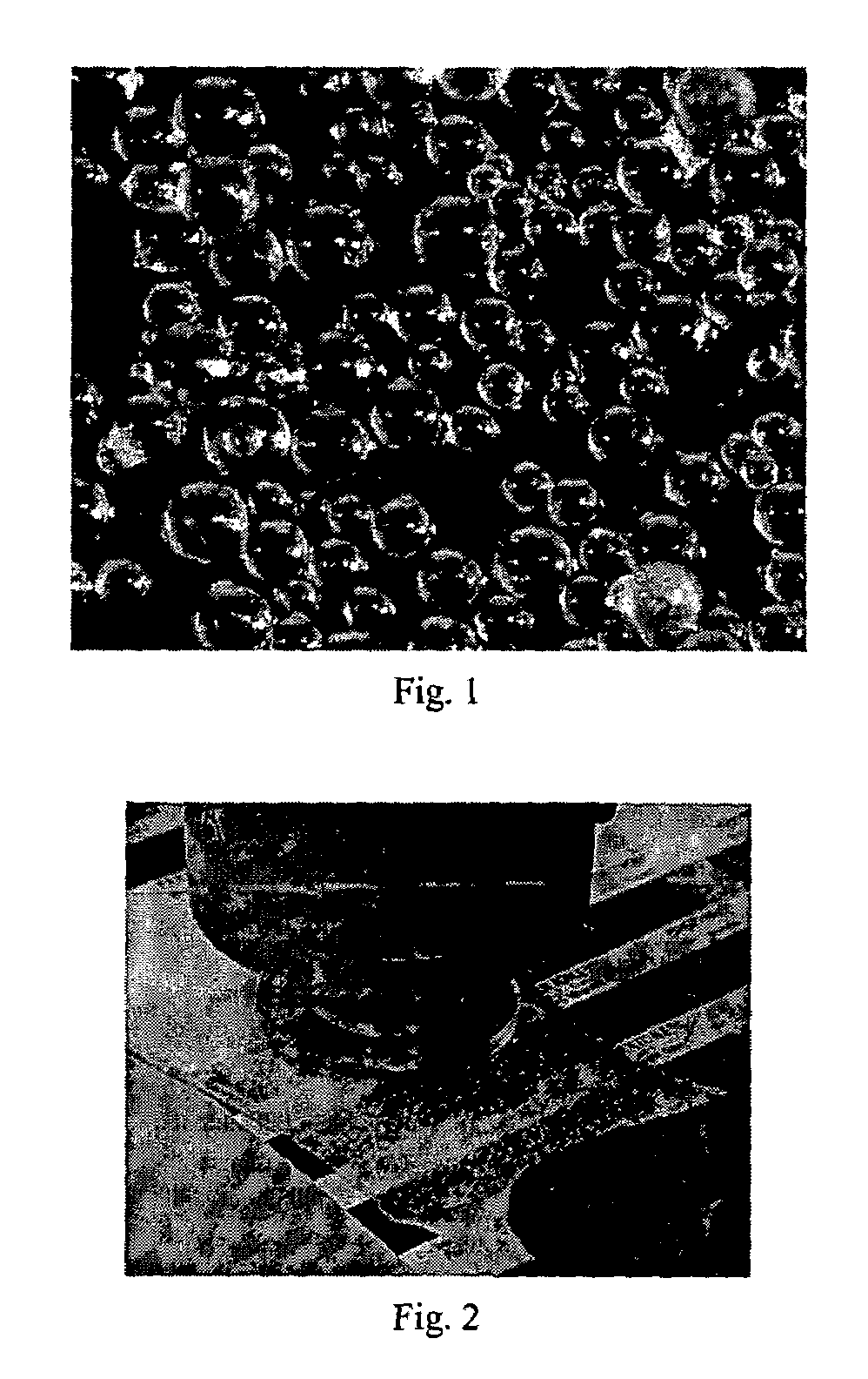 Liquid absorbent thermoplastic composition comprising superabsorbent material particles of substantially angle-lacking shape