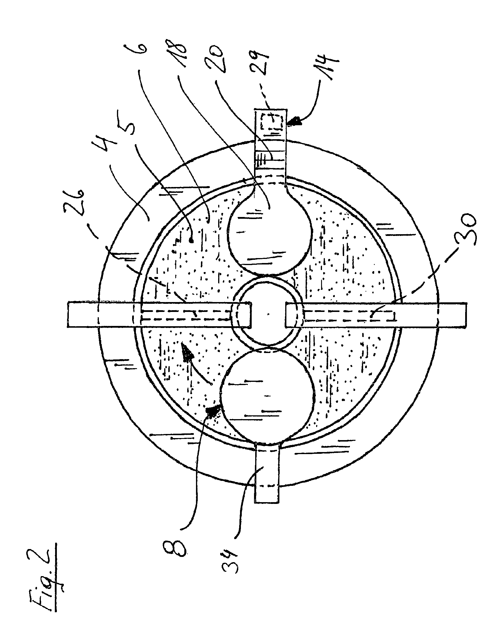 Device and method for processing light-polymerizable material for building up an object in layers