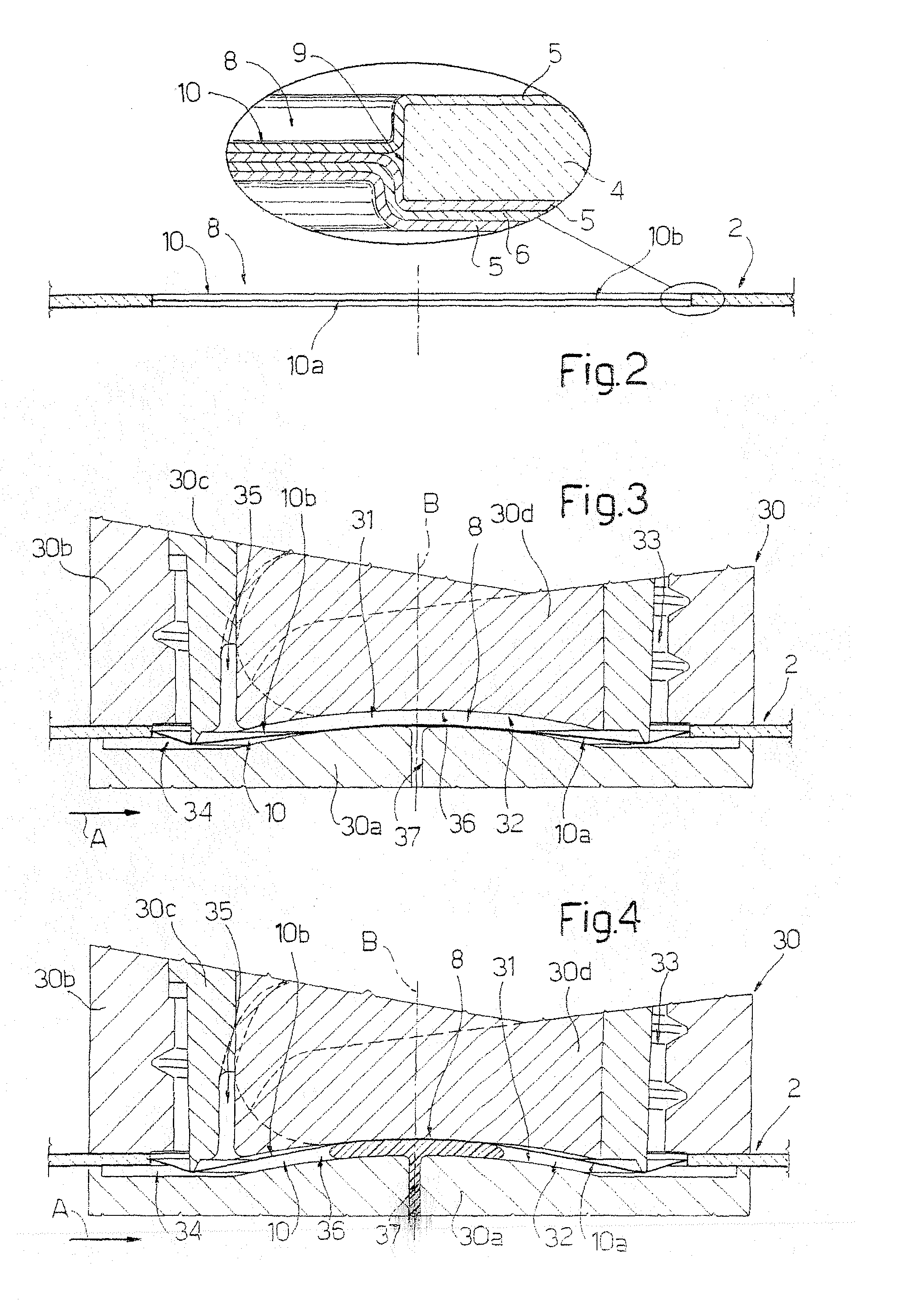 Method of injection molding opening devices on sheet material for packaging pourable food products, and packaging material and package obtained thereby