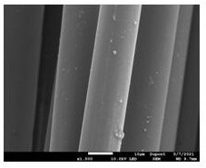 Continuous production process for enabling silver metal to be firmly attached to aromatic special fiber filaments