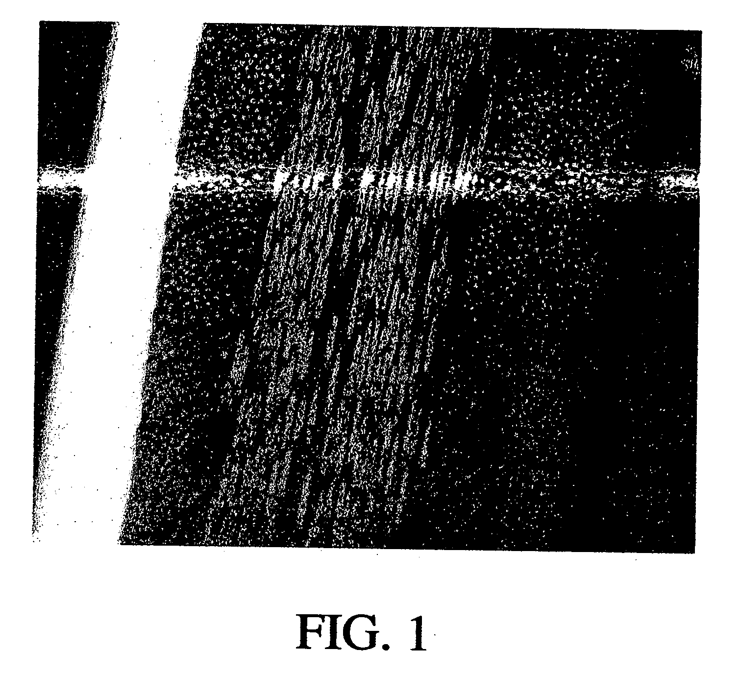 Article comprising a fine-grained metallic material and a polymeric material