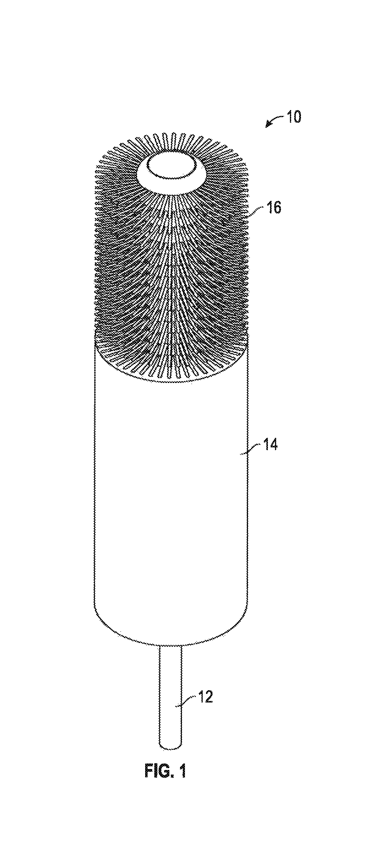 Twisted in wire brush having a molded tip and method of assembly therefor