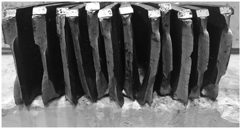 A method for producing x65 acid-resistant pipeline steel plates used under low-cost and ultra-low temperature conditions by a coiling furnace