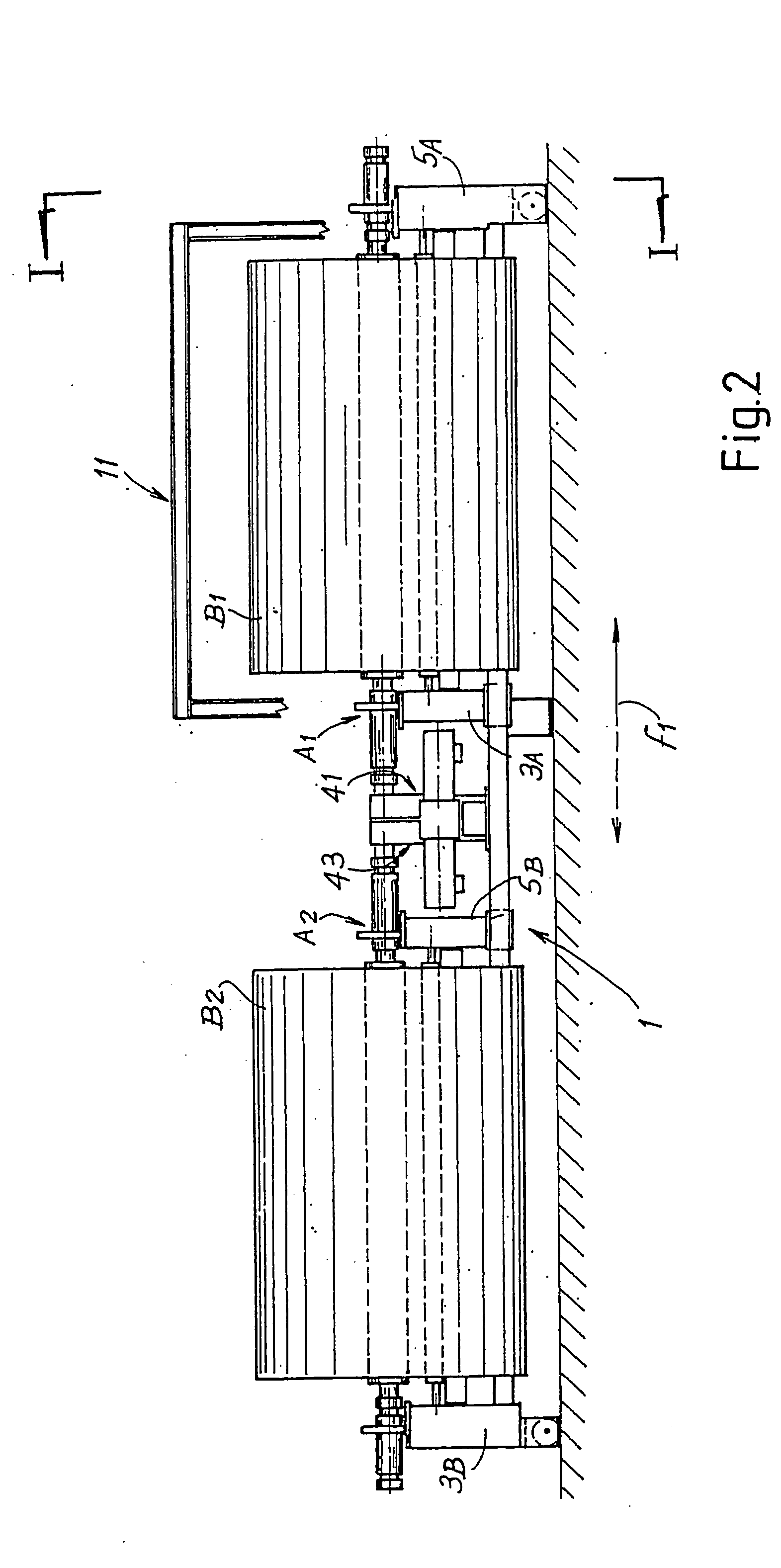 Unwinding device for reels of web material with dual drive mechanism and relative unwinding method