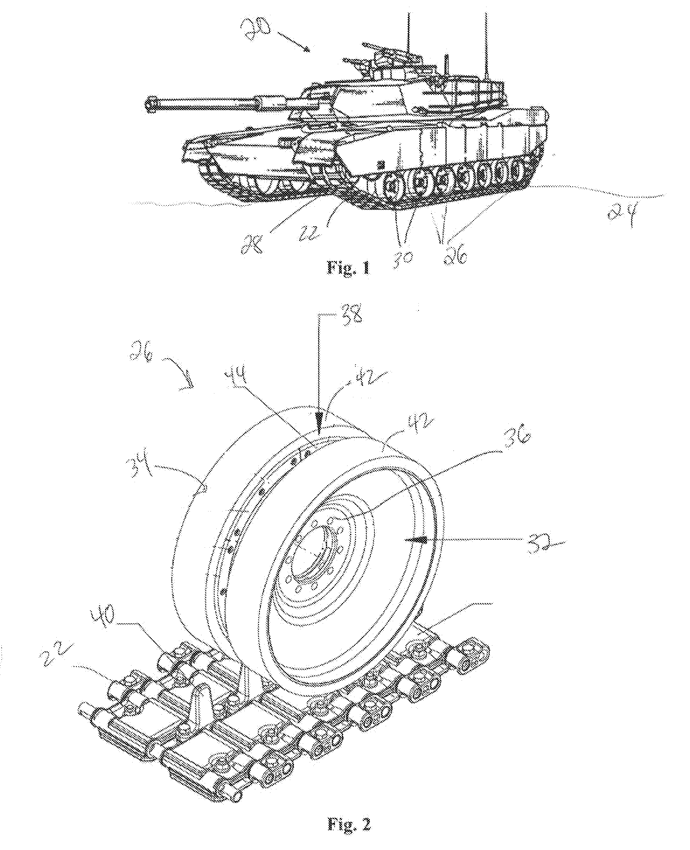 Elastomeric tire for a tracked vehicle