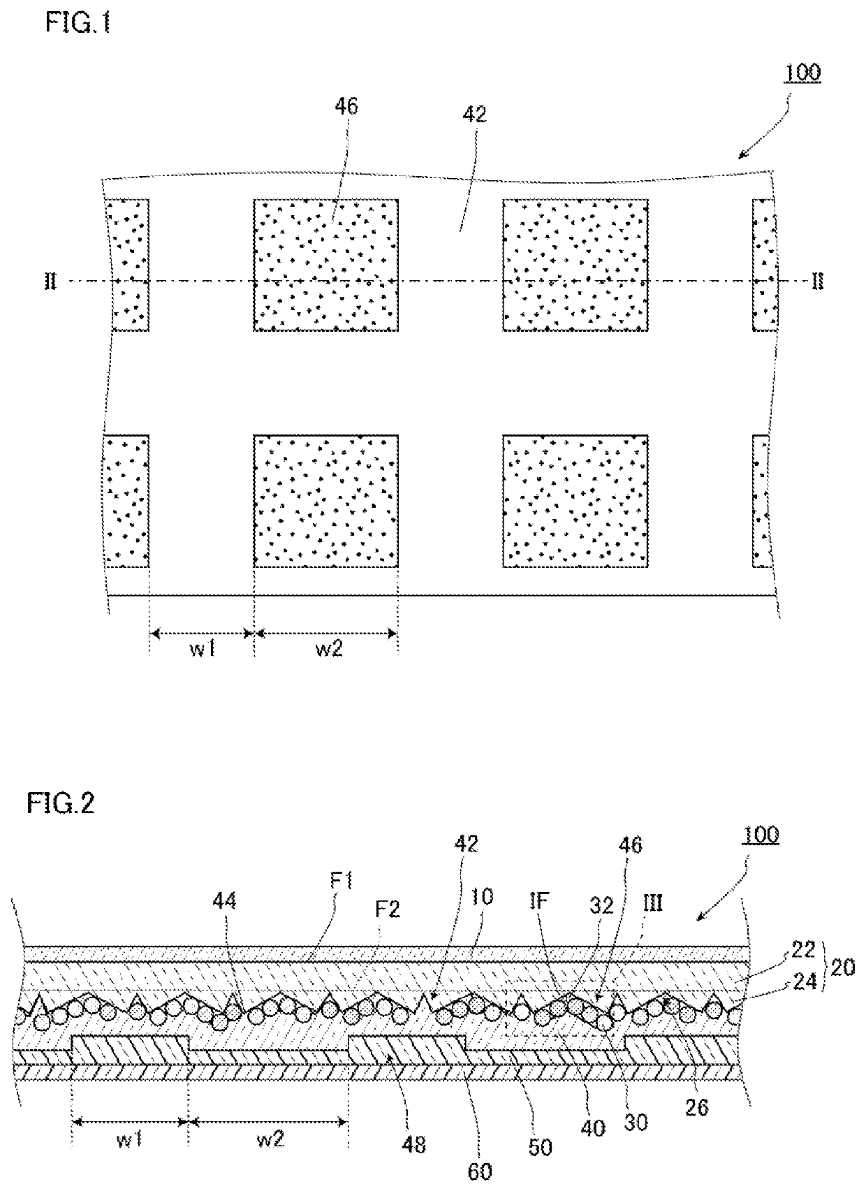 Retroreflective sheet having particles disposed between retroreflective elements and back face layer