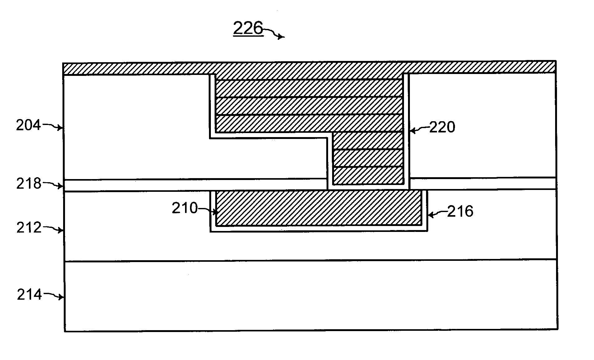 Interconnect with multiple layers of conductive material with grain boundary between the layers