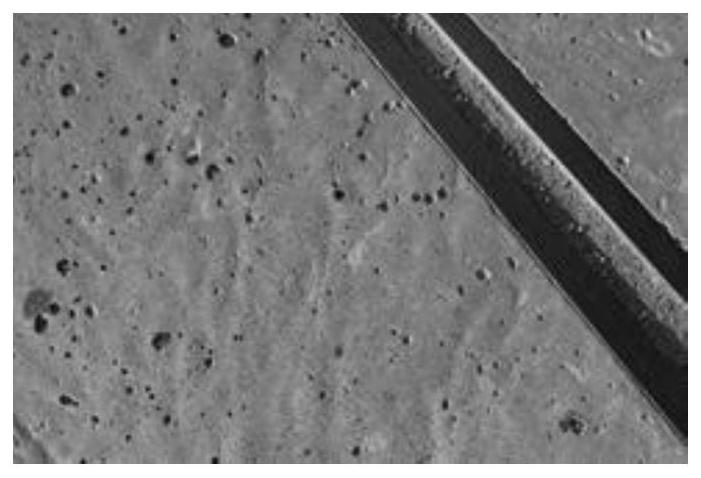 An all-in-one machine for leveling and texture of ultra-high toughness cement-based composite materials for road engineering and its working method