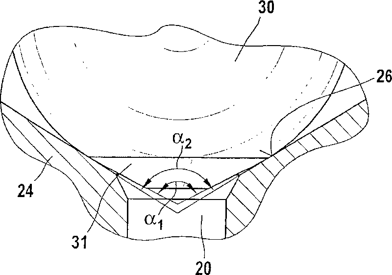 Fuel injector with punch-formed valve seat for reducing armature stroke drift