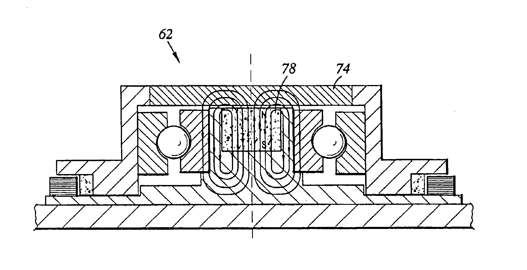 Spindle motor including magnetic element for pre-loading a ball bearing set