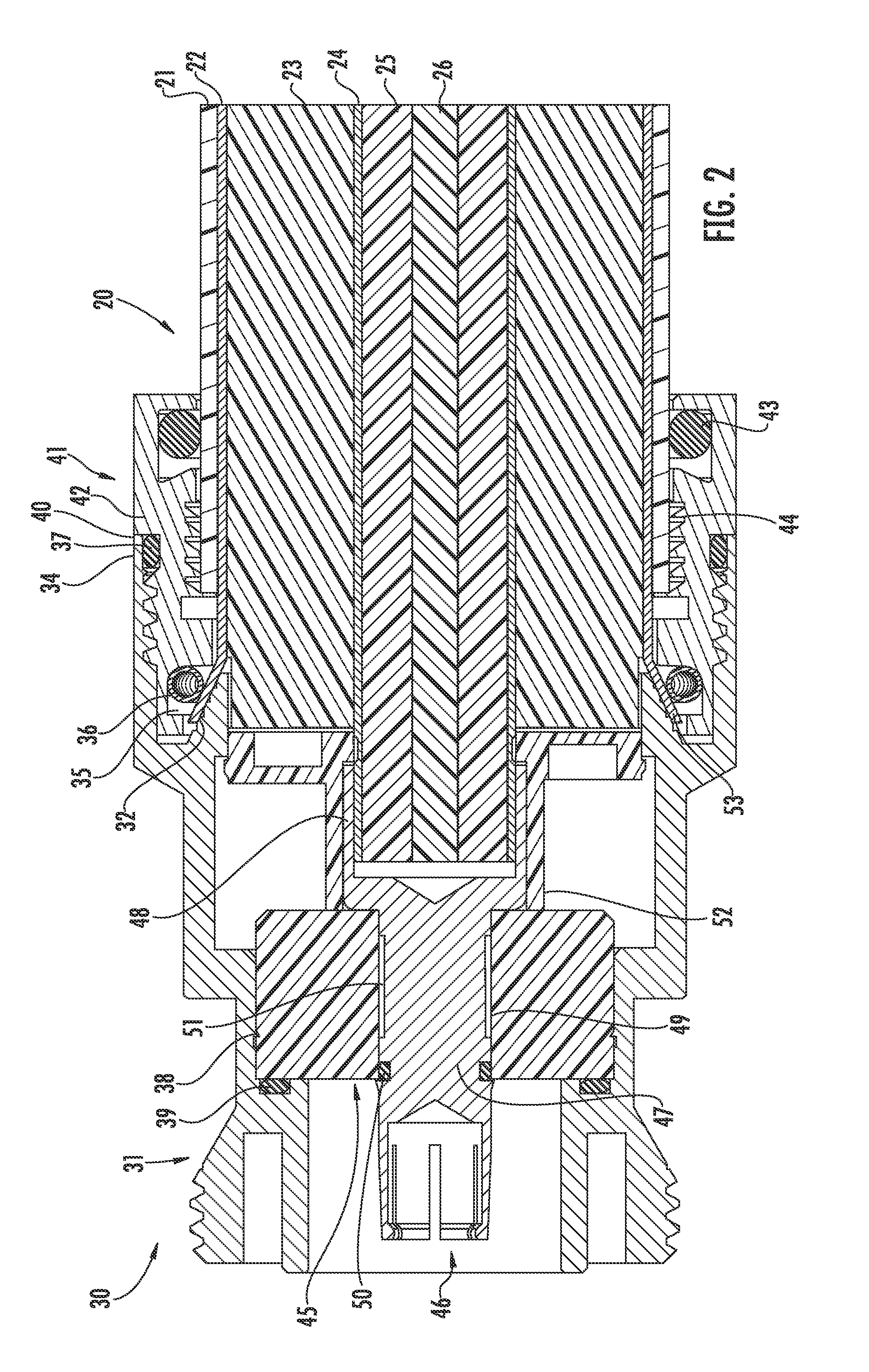Connector for coaxial cable having rotational joint between insulator member and center contact and associated methods