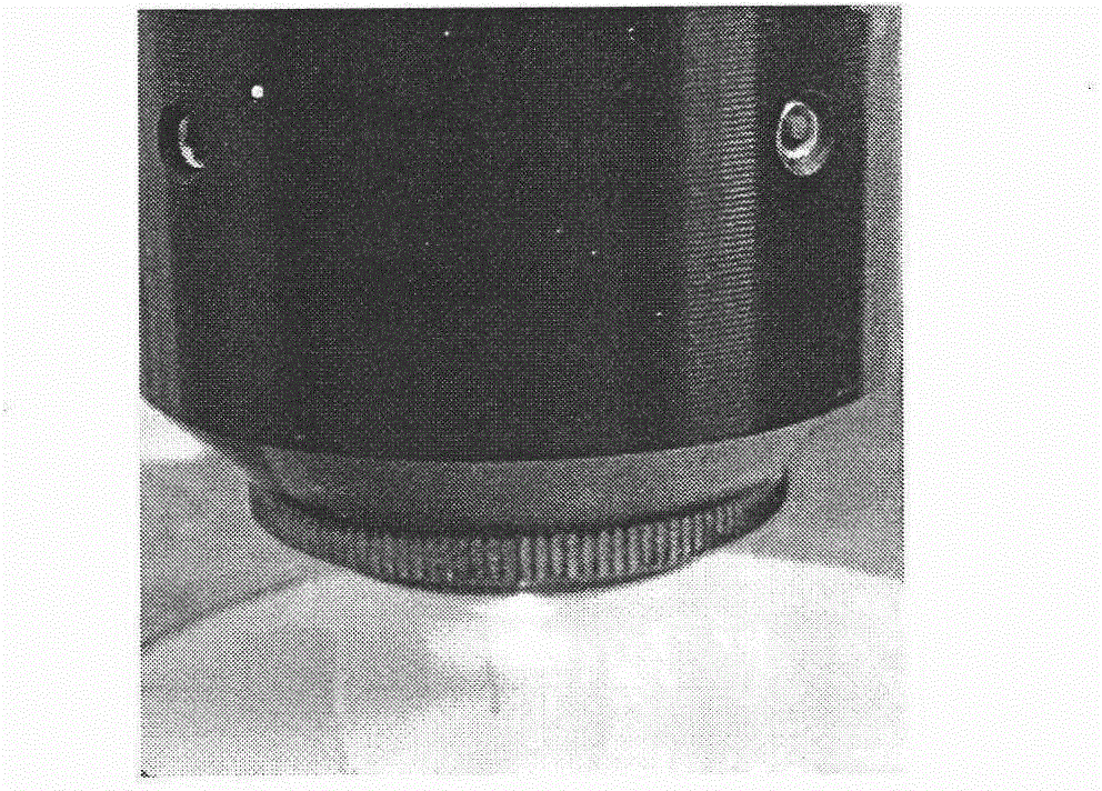 Method for reinforcing akermanite bone scaffold in selective laser sintering by utilization of nano titanium oxide