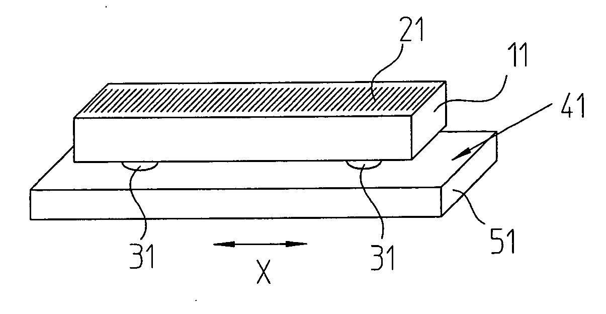 Method for attaching a scale to a carrier, a scale, and carrier having a scale