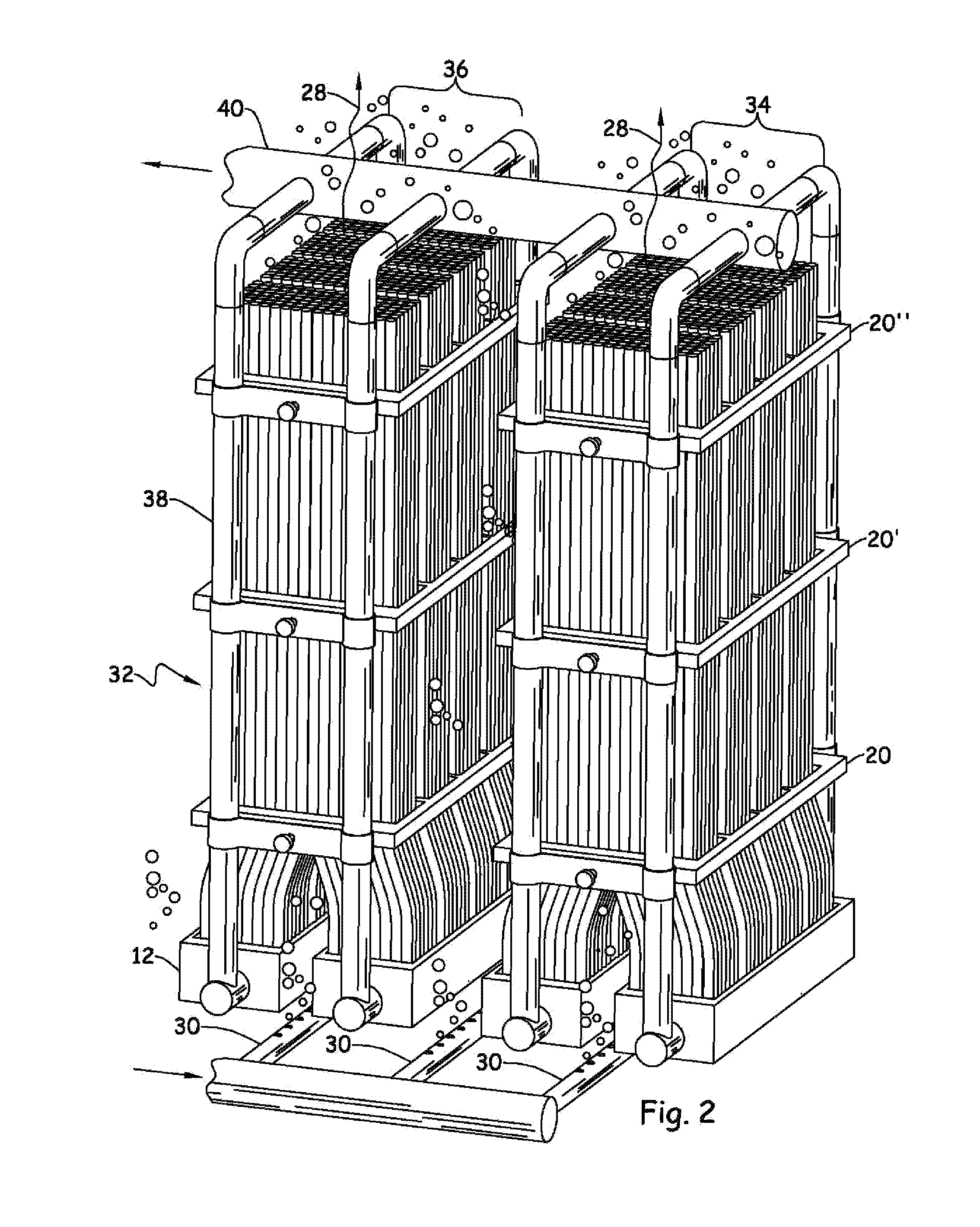 Filtration assembly including multiple modules sharing common hollow fiber support