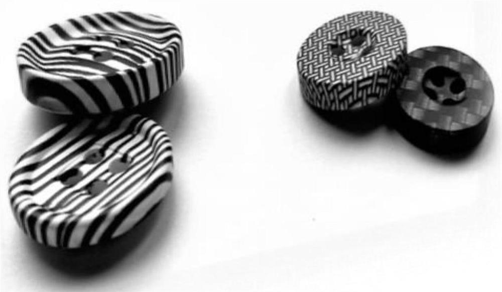 A button treatment process with surface coating and transfer printing effect