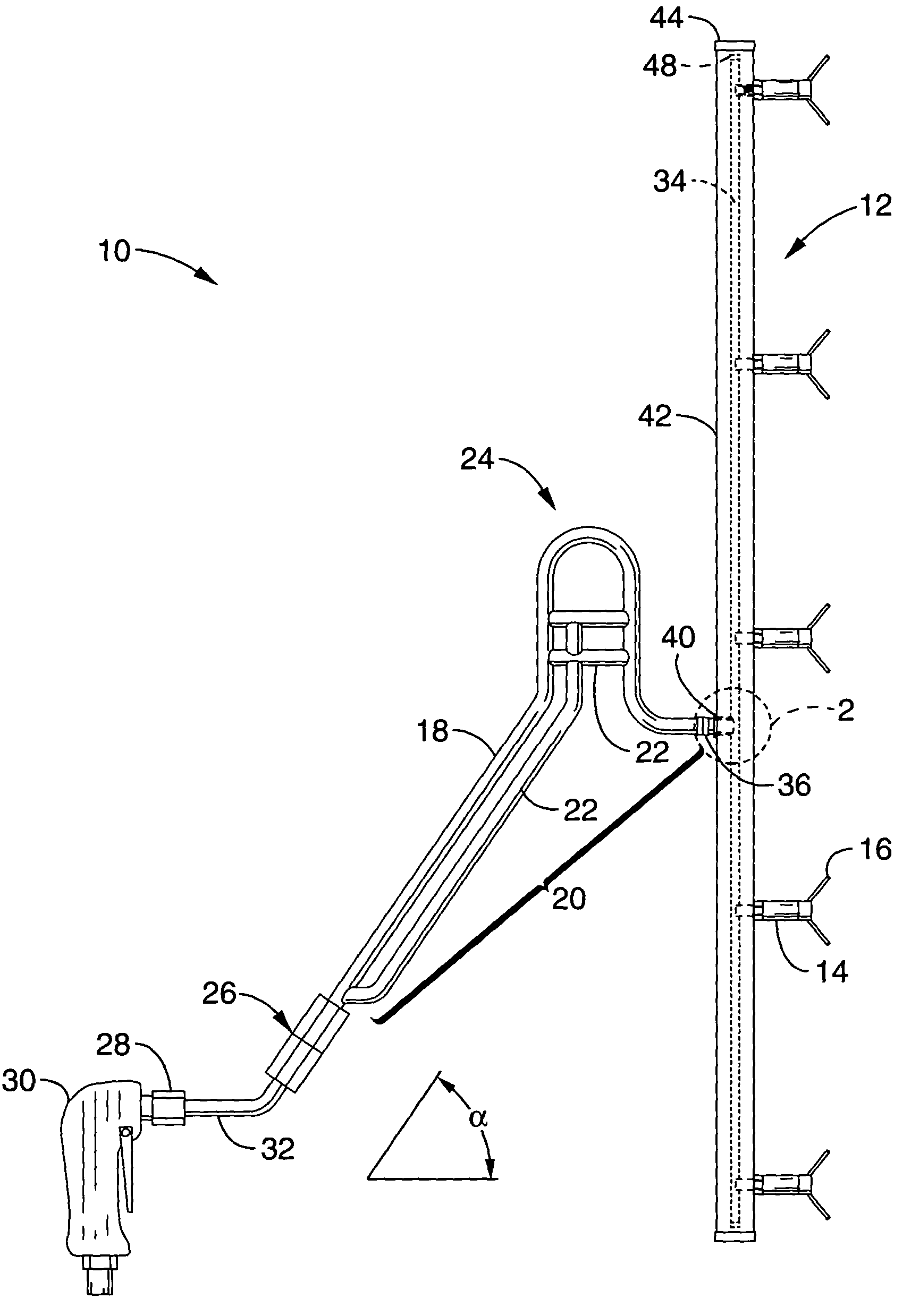 Handheld paint spraying apparatus with anti-sputter spray nozzle