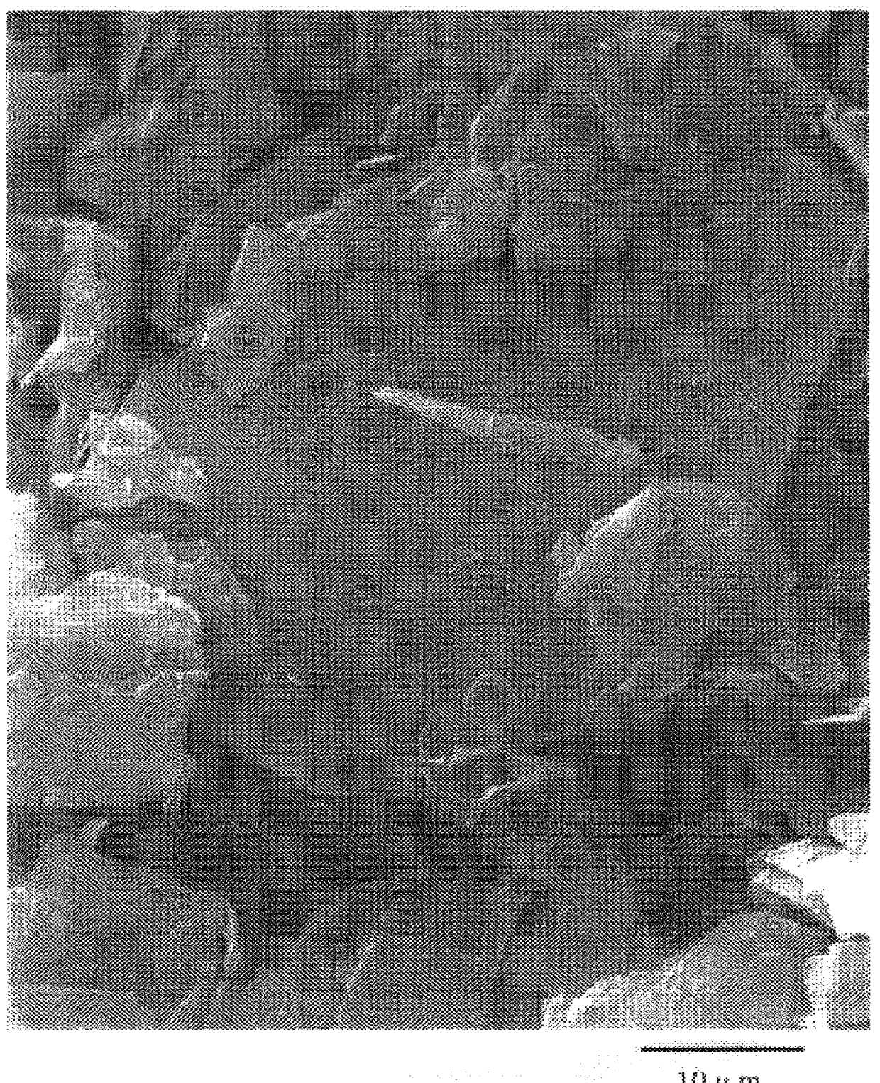 Modified graphite particles derived from scaly natural ones, production thereof and secondary battery