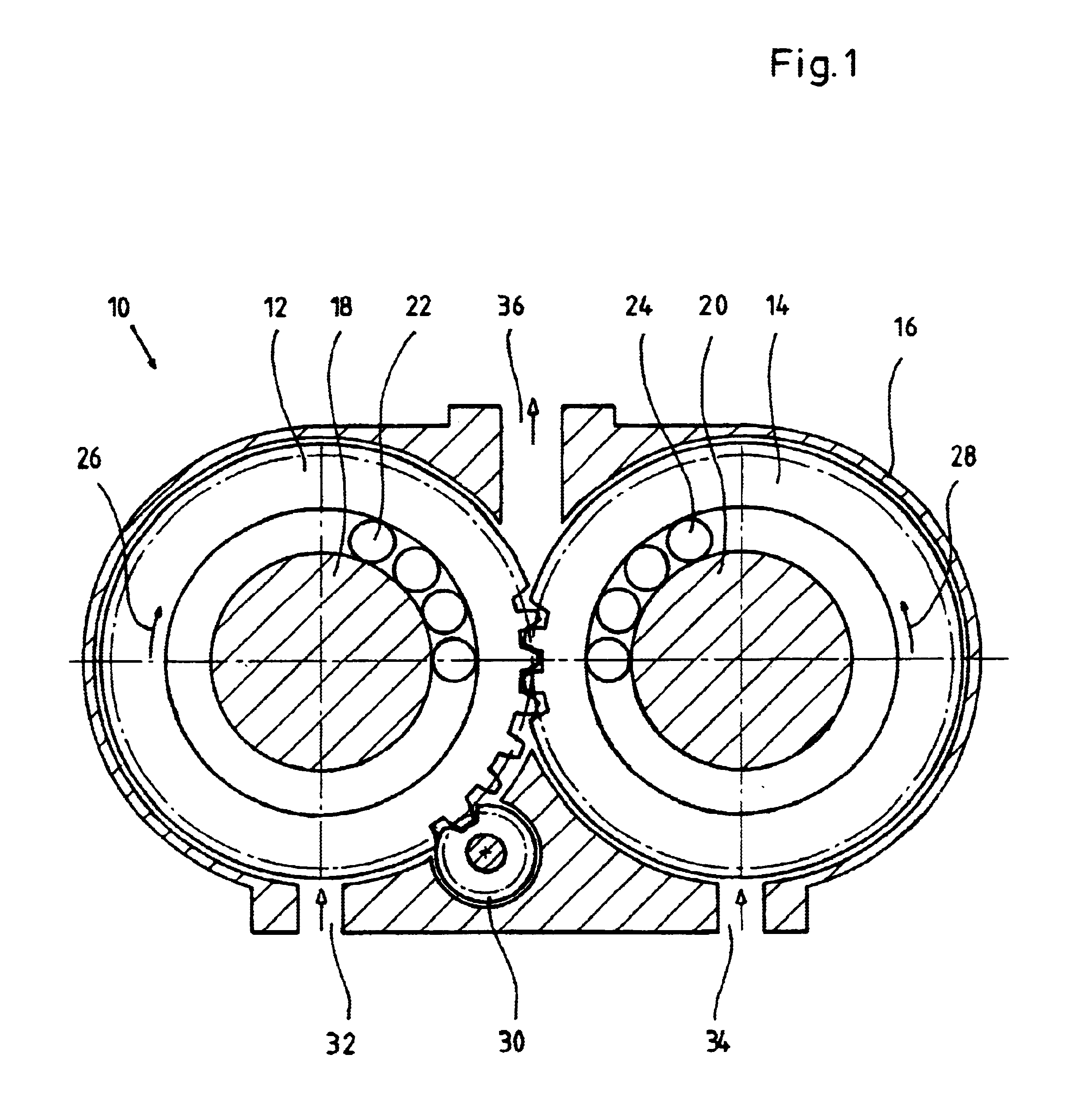 Rotary displacement machine having at least two annular displacement gears and supply channels