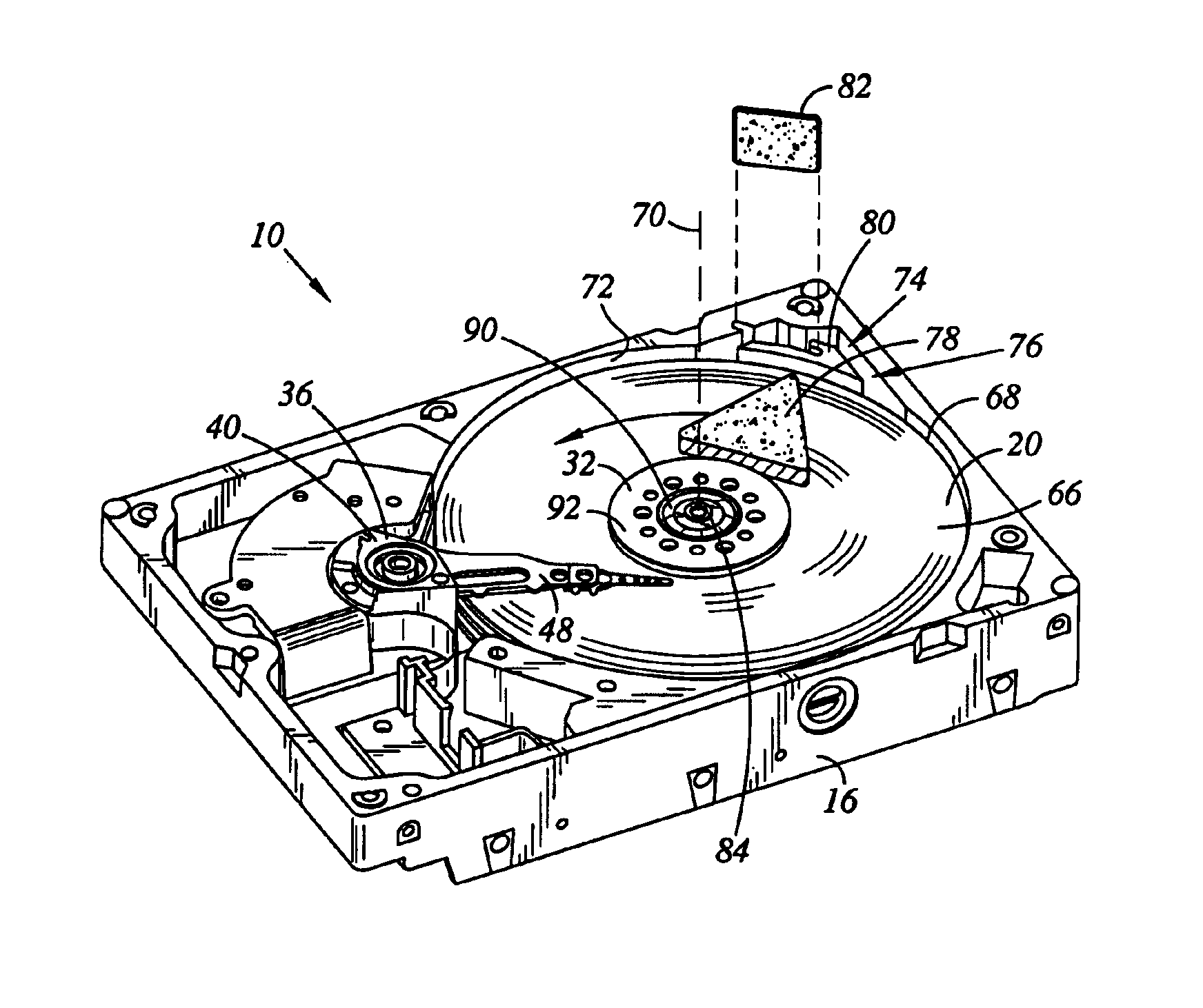 Disk drive including an airflow diverter element radially between spindle motor axis of rotation and cavity in shroud surface