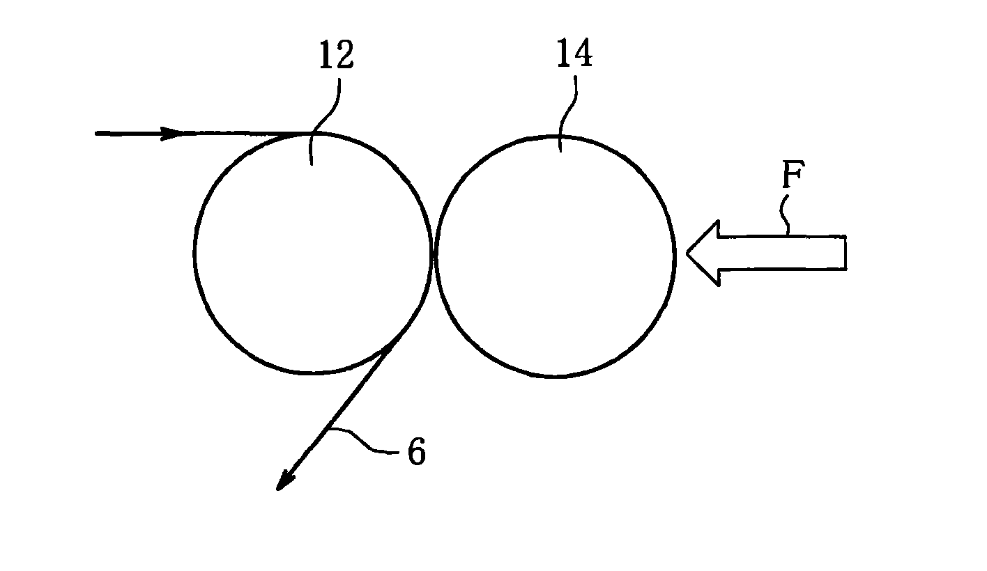 Low fire spreading cigarette, wrapping paper for the cigarette, and method of producing wrapping paper