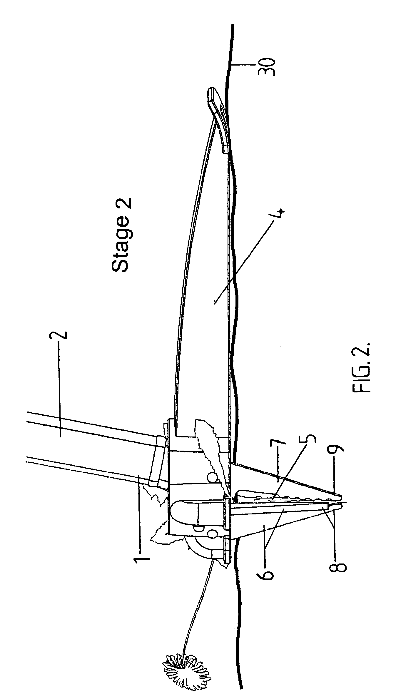 Device for removing plants or the like from ground