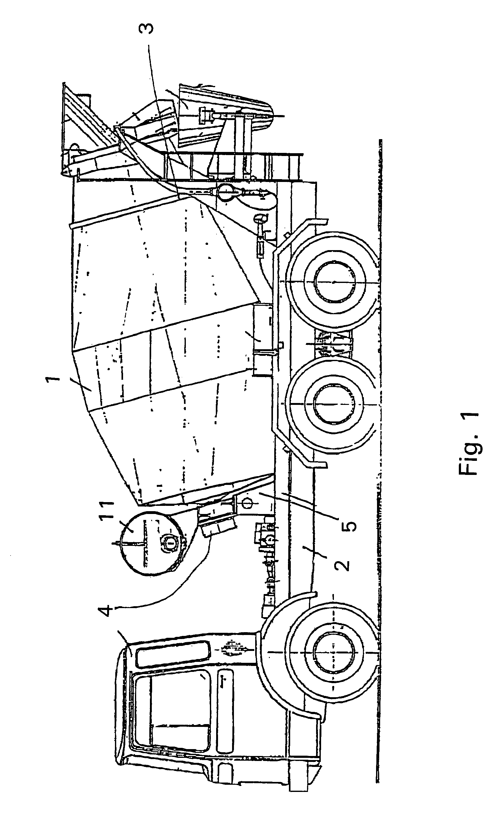 Drive for mixing drum with elastic element arranged between bearing incorporating drive system and base